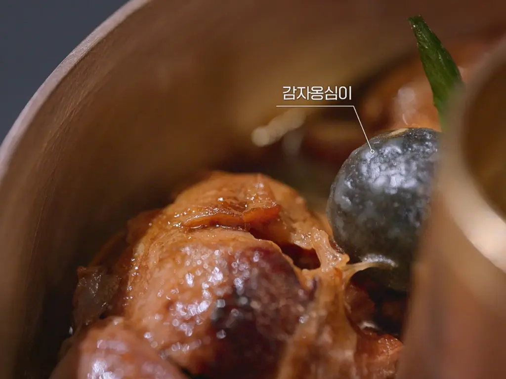 Chef Kim Hee-eun’s smoked black pork shank steamed dish with apple pickles