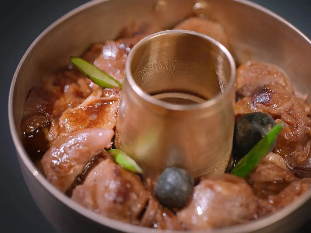 Chef Kim Hee-eun’s smoked black pork shank steamed dish with apple pickles