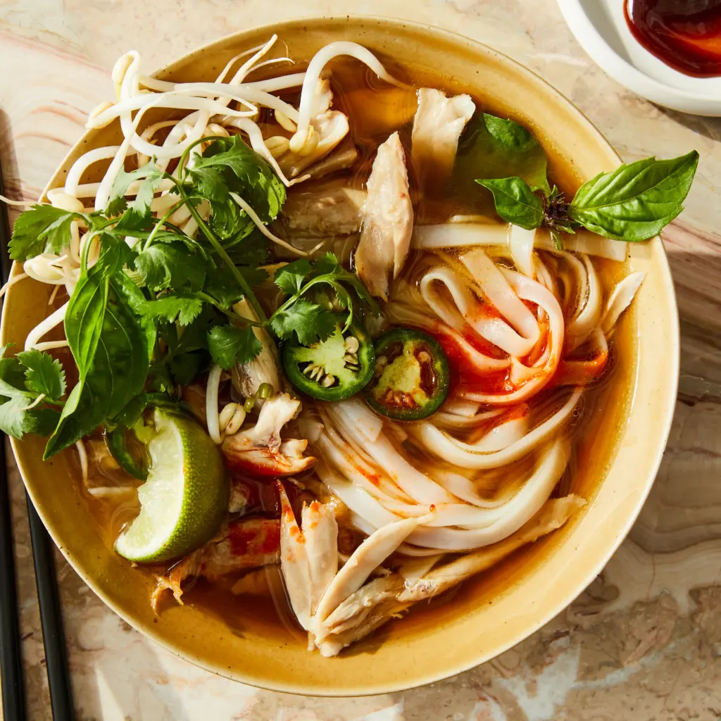 Bangchan's Favorite Food: Top 10 Must-Try Picks for SKZ Fans Bang Chan SKZ eating pho favorite food