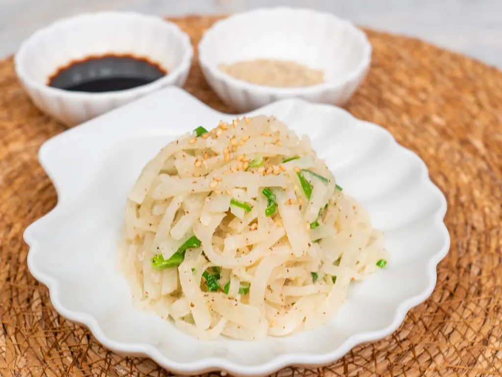 Easy Korean Radish Side Dish (Mu Namul Recipe) with Perilla Seeds Authentic Mu Namul with perilla seeds: A staple Korean banchan.
