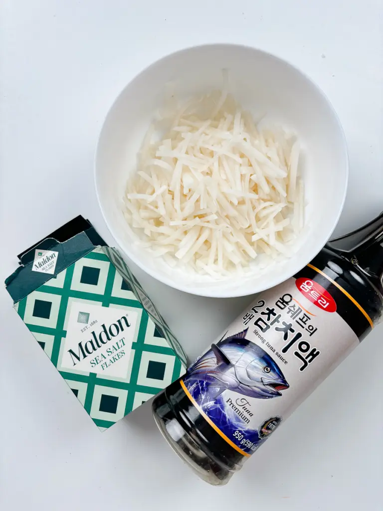 Easy Korean Radish Side Dish (Mu Namul Recipe) with Perilla Seeds Freshly julienned Korean radish ready for Mu Namul recipe.