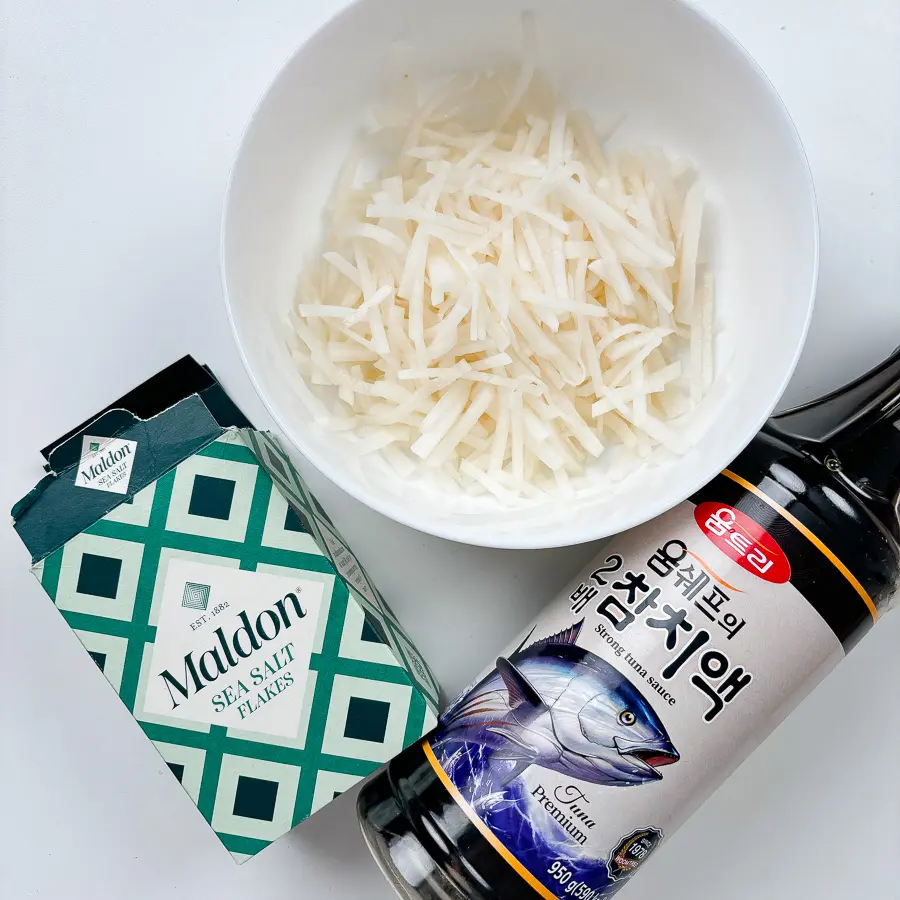 Easy Korean Radish Side Dish (Mu Namul Recipe) with Perilla Seeds Freshly julienned Korean radish ready for Mu Namul recipe.