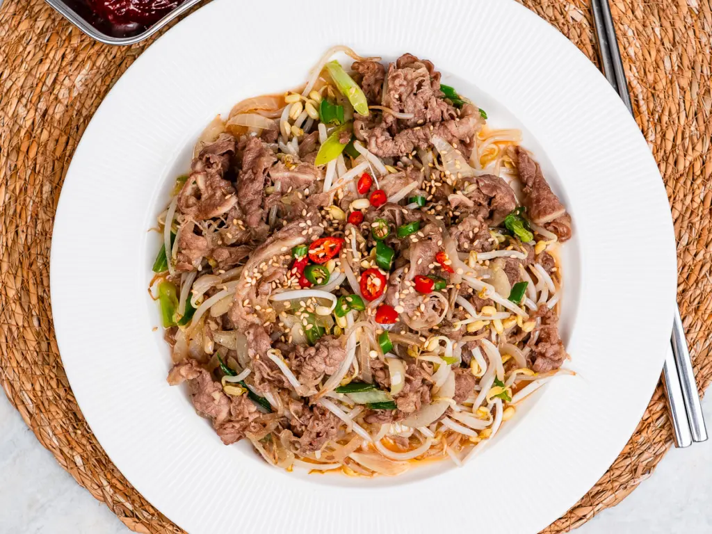 Easy 10 minute Korean beef recipe with thin sliced brisket bean sprouts and garlic sauce