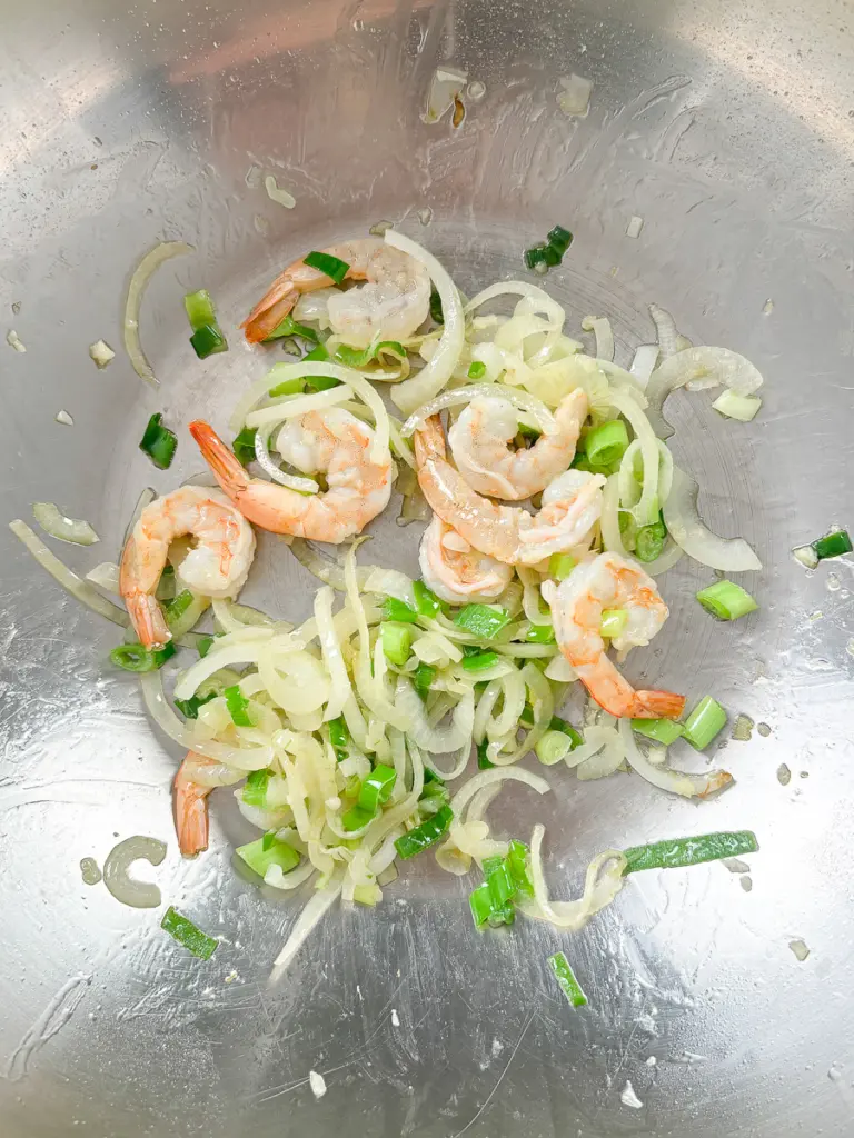 Shrimp added to the pan at 80% cooked — the timing secret for perfect shrimp yaki udon