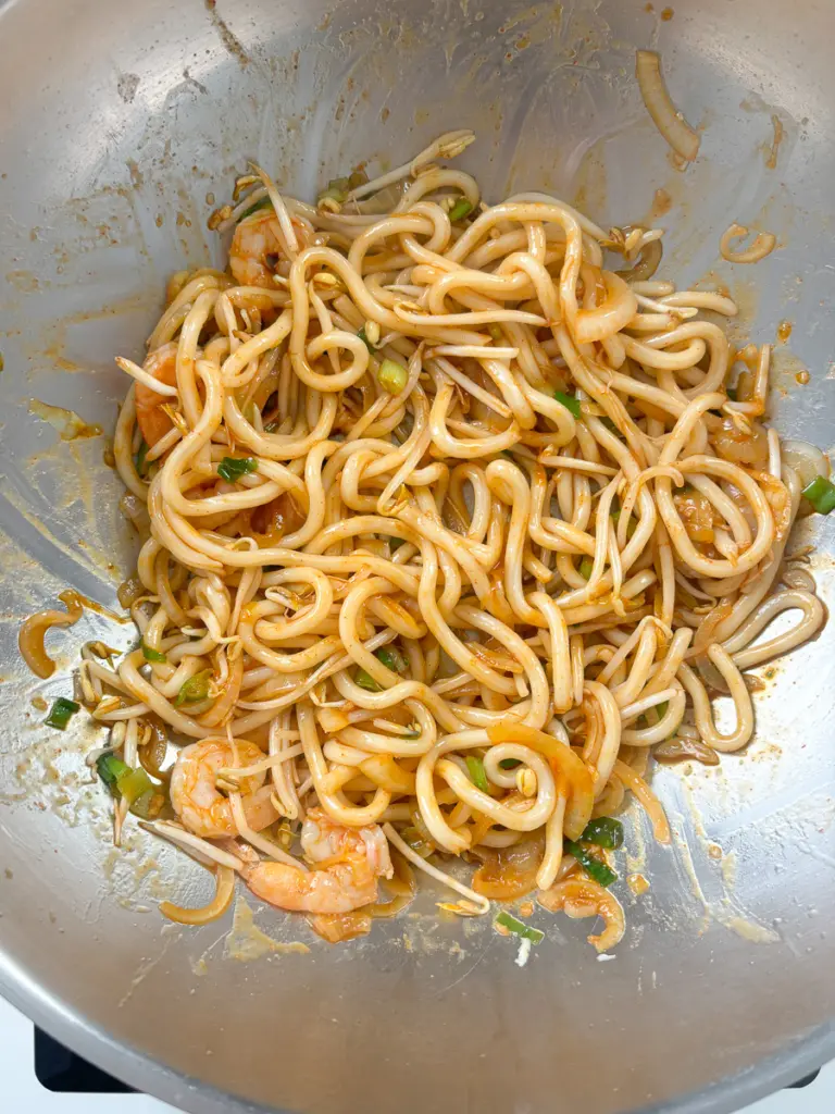 Carbon steel wok pan for high-heat stir fried udon recipe — creates the best Maillard reaction