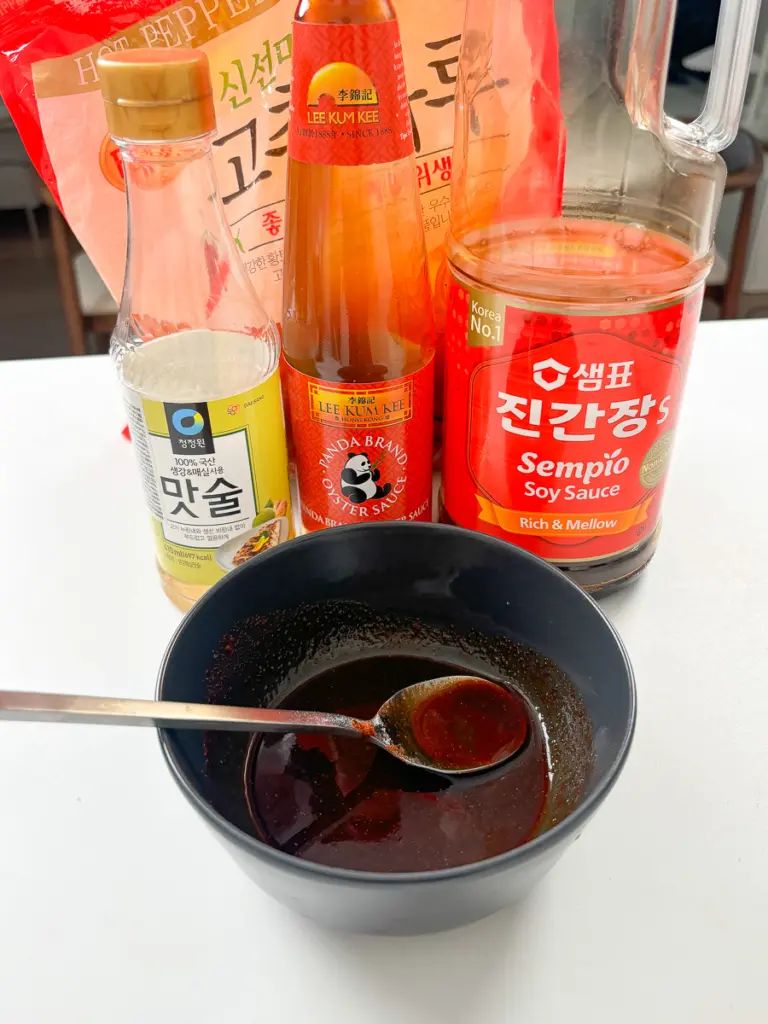 Spicy Korean shrimp yaki udon sauce mixed in a bowl — oyster sauce, soy sauce, mirin, sugar, and gochugaru