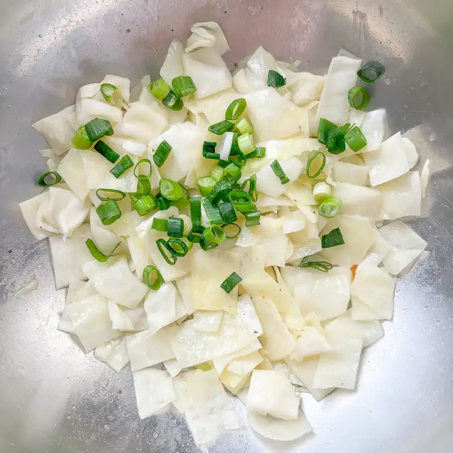 Add water to the pan so your Korean cabbage stir fry cooks evenly without burning.