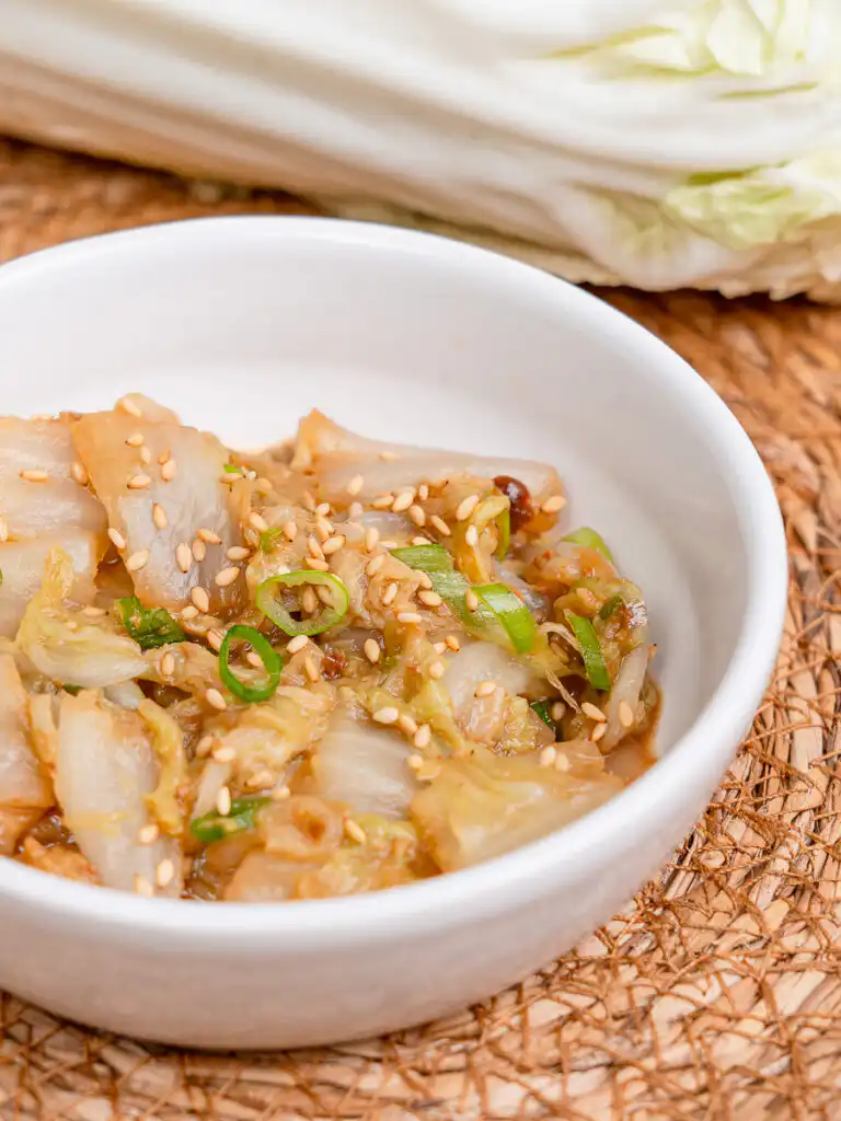 Best Korean Cabbage Side Dish Recipe – Doenjang Baechu Namul baechu namul korean cabbage side dish with sesame oil finish served in traditional korean ceramic bowl
