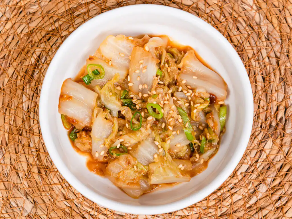 Best Korean Cabbage Side Dish Recipe – Doenjang Baechu Namul korean cabbage banchan baechu namul close up showing glossy doenjang sauce coating on tender napa cabbage