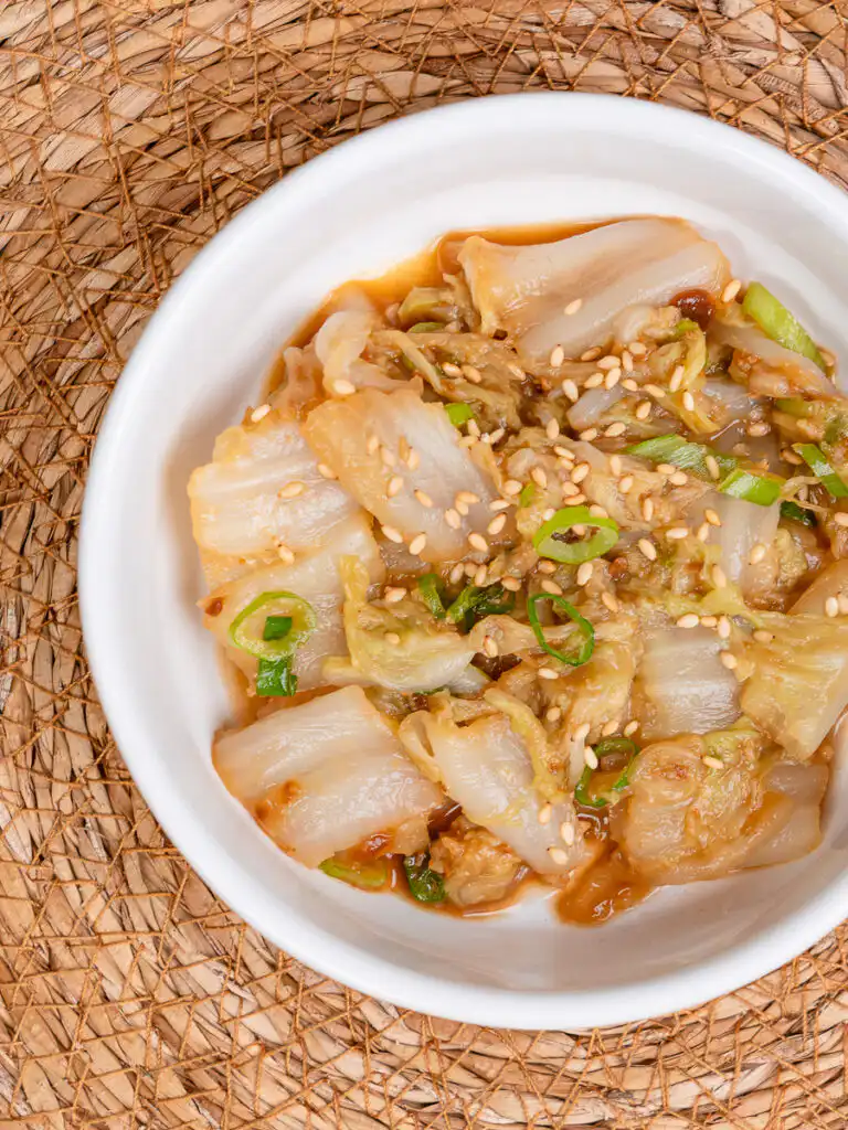 Best Korean Cabbage Side Dish Recipe – Doenjang Baechu Namul korean cabbage banchan baechu namul close up showing glossy doenjang sauce coating on tender napa cabbage