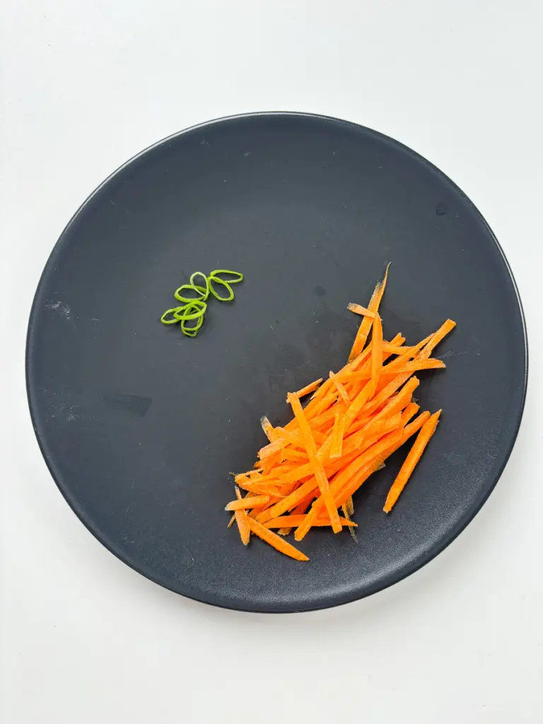 Julienned carrots prepped for easy Korean potato side dish gamja bokkeum