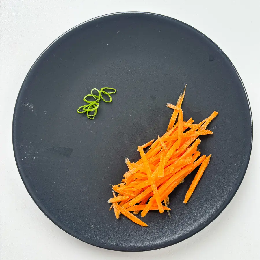 Julienned carrots prepped for easy Korean potato side dish gamja bokkeum