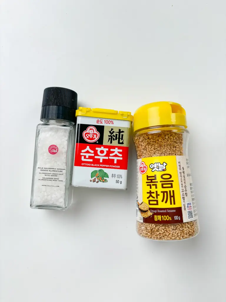 Salt pepper and MSG seasoning added to stir fried potatoes for Korean potato side dish