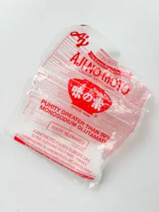 MSG seasoning added to stir fried potatoes for Korean potato side dish