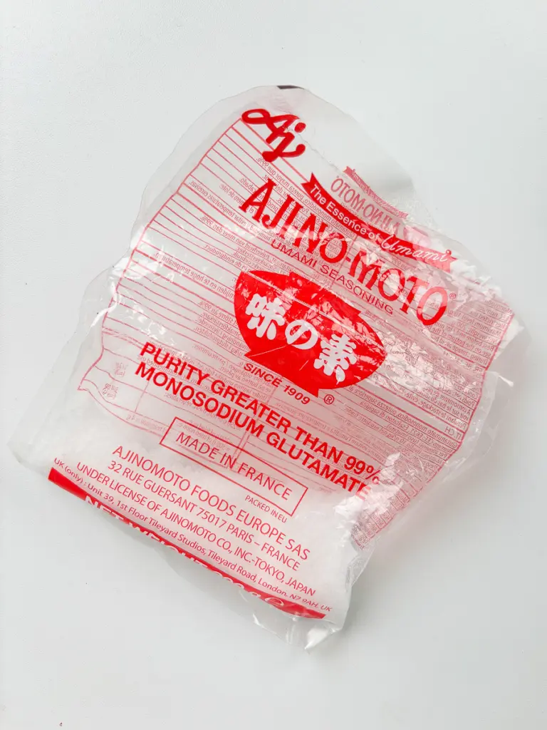 MSG seasoning added to stir fried potatoes for Korean potato side dish