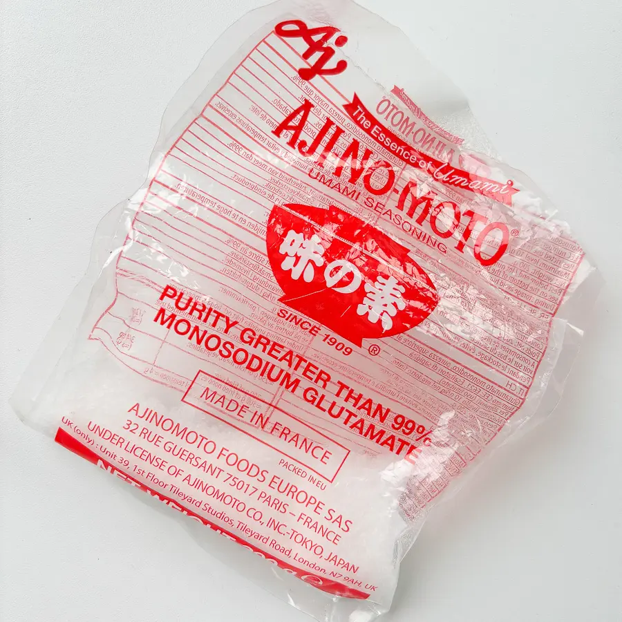 MSG seasoning added to stir fried potatoes for Korean potato side dish