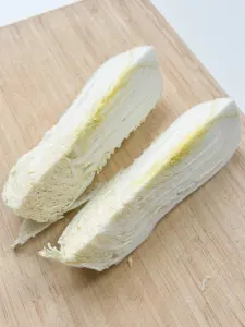 cutting napa cabbage into wedges for pan fried cabbage steaks