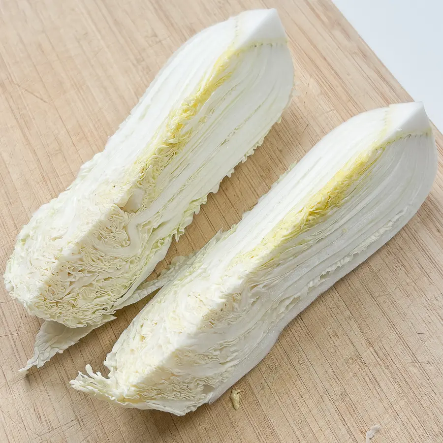 cutting napa cabbage into wedges for pan fried cabbage steaks