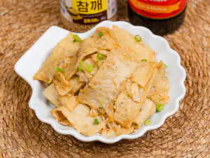 Overhead shot of eomuk bokkeum in a shallow ceramic dish