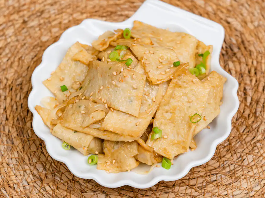 Korean fish cake banchan served in a white porcelain bowl