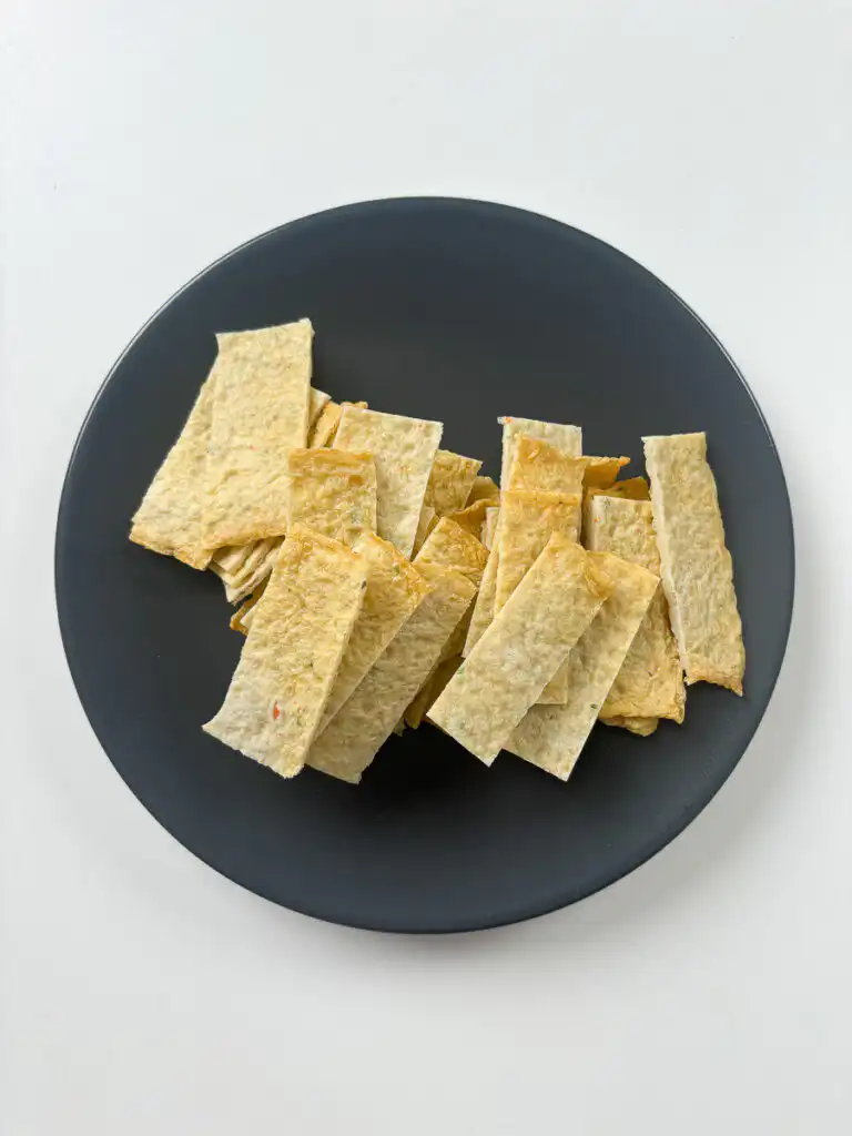 Korean fish cake sheets being cut into 2cm strips