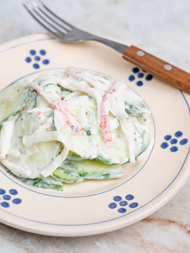 close up of shredded crab sticks coated in greek yogurt dressing