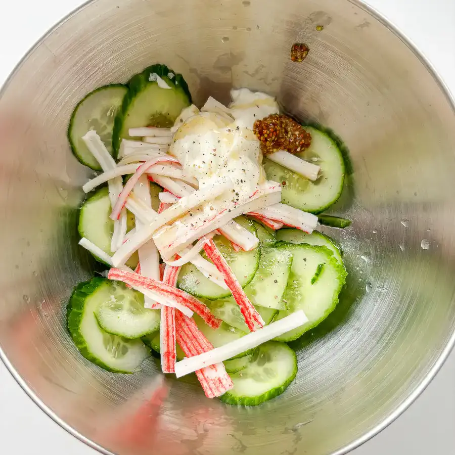 sliced cucumber and shredded crab sticks before tossing in dressing