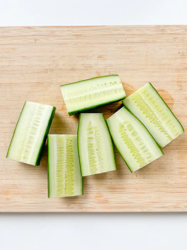 halve the cucumber for cubed cucumber kimchi called oil kkakdugi