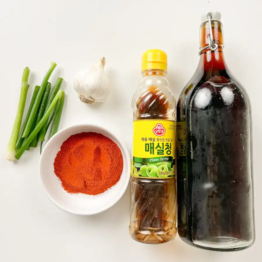 Cubed cucumber kimchi - 30Min Quick Kimchi Recipe Flat lay of all cubed cucumber kimchi ingredients on white background