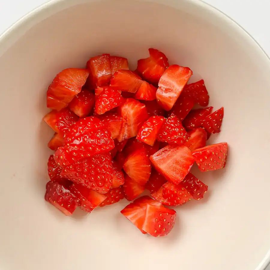 Viral Strawberry Matcha Ice Cream Sandwich strawberry cubes macerating with sugar in a bowl for strawberry matcha ice cream