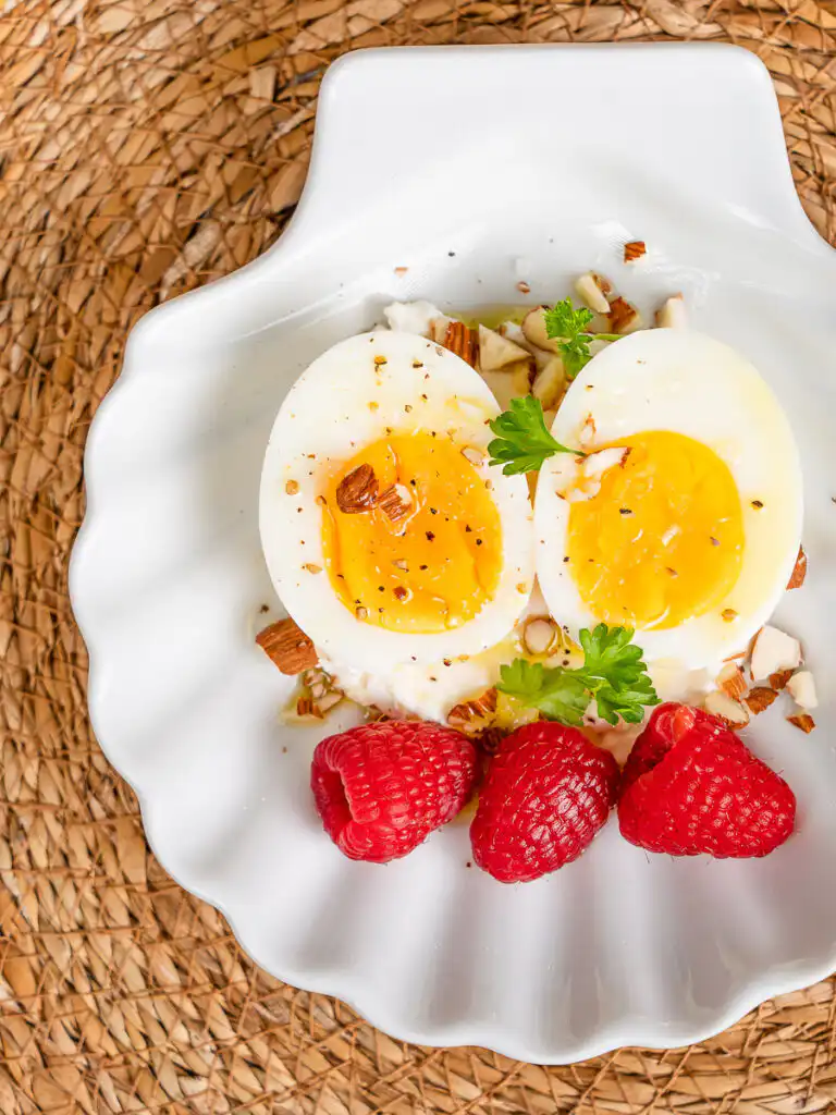 Natural Wegovy Healthy Egg Breakfast: GLP-1 Food rendy Korean natural wegovy recipe plating closeup rough-chopped almonds scattered over ricotta and egg.