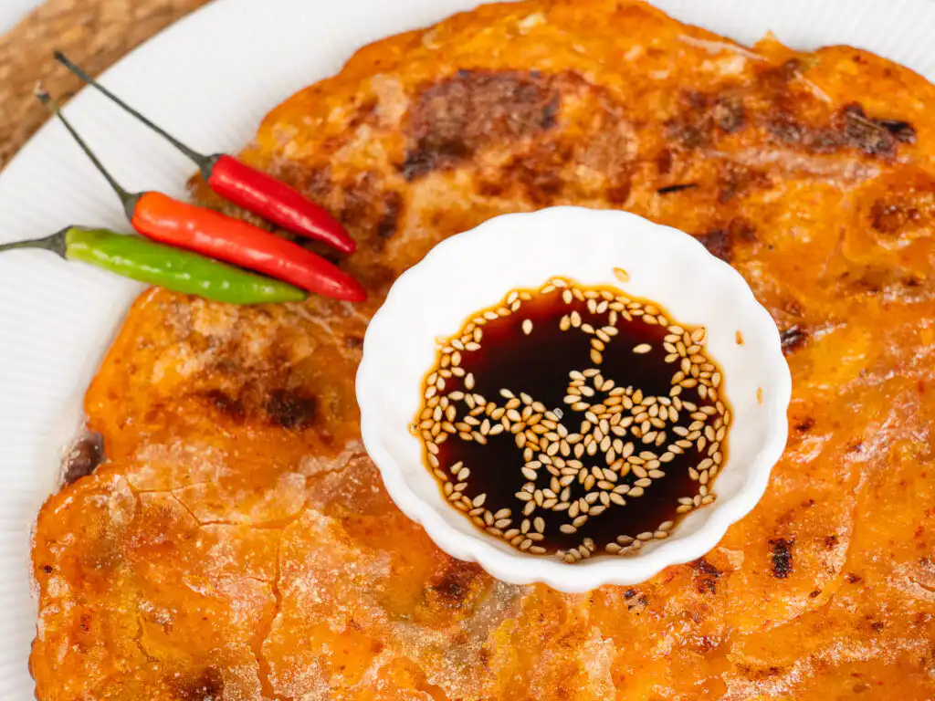 Crispy kimchi pancake with dipping soy sauce