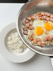 Sausage and Rice Recipe: 5-Min Korean Sausage Butter Rice Rice bowl assembly: rice first, then sausage and rice recipes Korean egg and sausage slid on top with all sauce