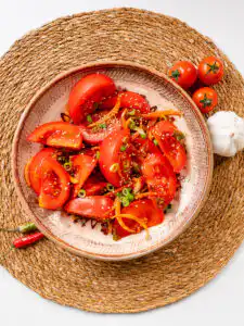 Tomato Kimchi Recipe: No Fermentation, Ready in 10 Minutes quick kimchi recipe tomato with sesame seeds top-down flat lay