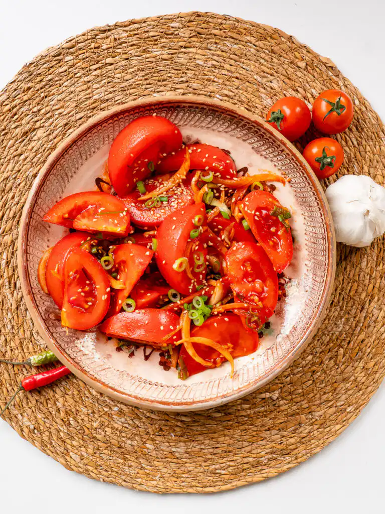 quick kimchi recipe tomato with sesame seeds top-down flat lay