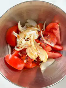Tomato Kimchi Recipe: No Fermentation, Ready in 10 Minutes tossing fresh kimchi recipe tomatoes gently with spoon