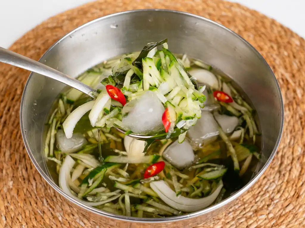 Korean Cucumber Soup (Oi Naengguk) - Best Cold Summer Soup Hydrating cold cucumber soup bowl with fresh cucumber and seaweed