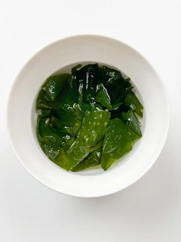 Dried seaweed soaking in cold water for Korean cucumber soup