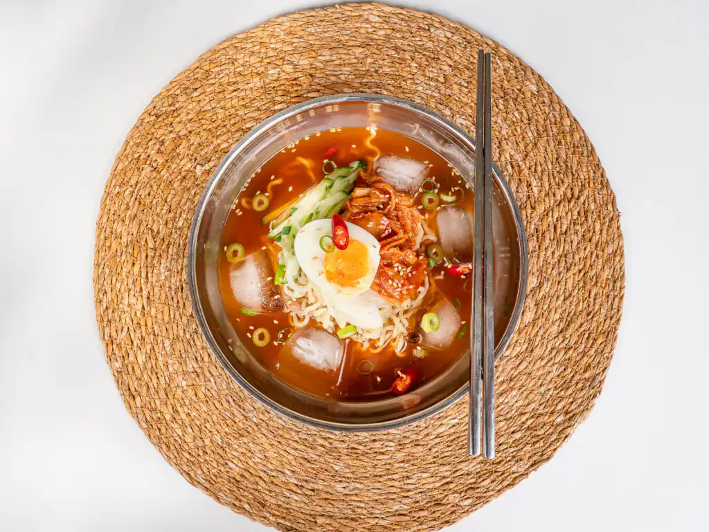 Cold ramyeon served with chopsticks