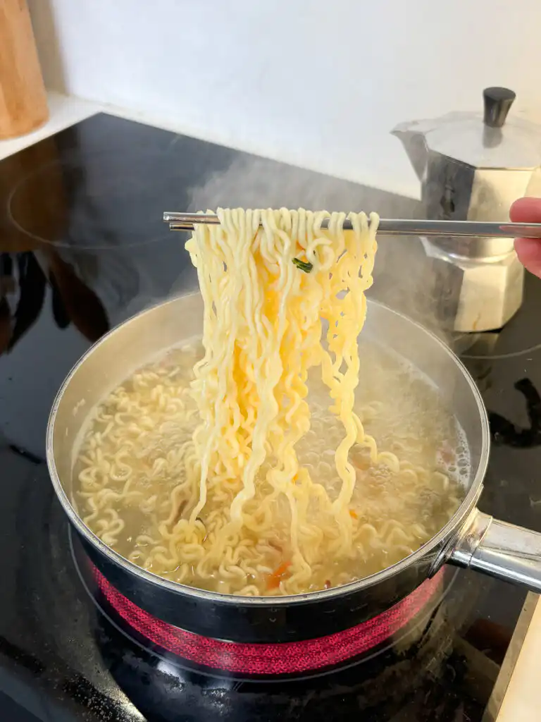 Cooking instant ramyeon noodles in boiling water