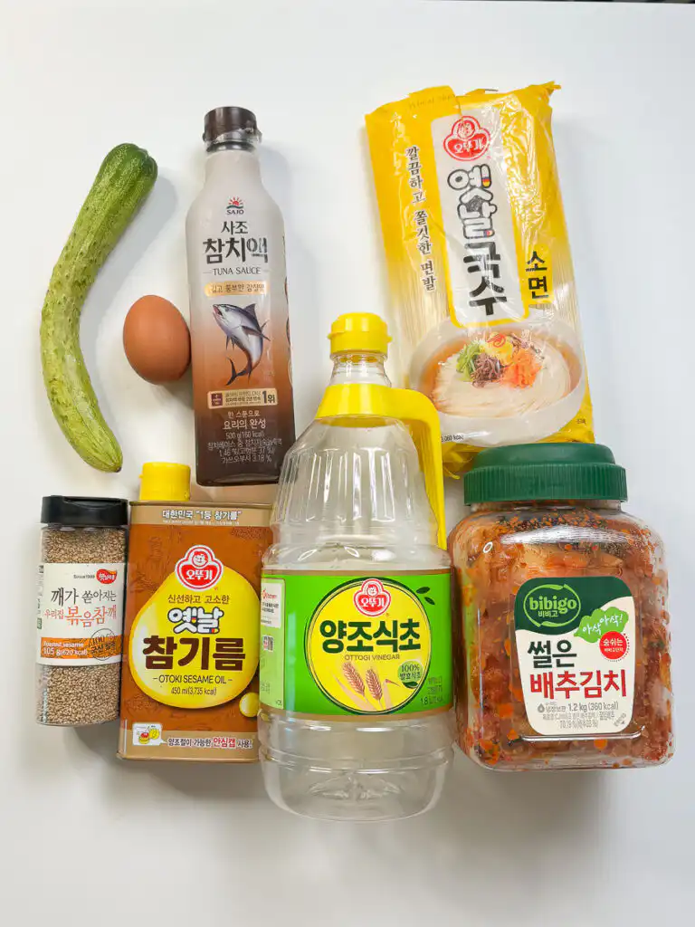 Grandma's Kimchi Korean Cold Noodles - Kimchi Mari Guksu All the ingredients for korean cold noodles laid out on a table