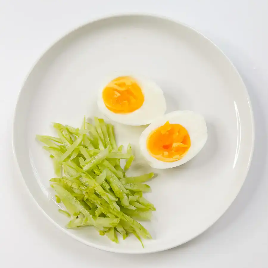 Grandma's Kimchi Korean Cold Noodles - Kimchi Mari Guksu a boiled egg and cucumber for toppings for the Korean cold noodles with kimchi