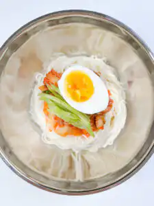 Grandma's Kimchi Korean Cold Noodles - Kimchi Mari Guksu All the toppings on the noodles for the kimchi mari guksu