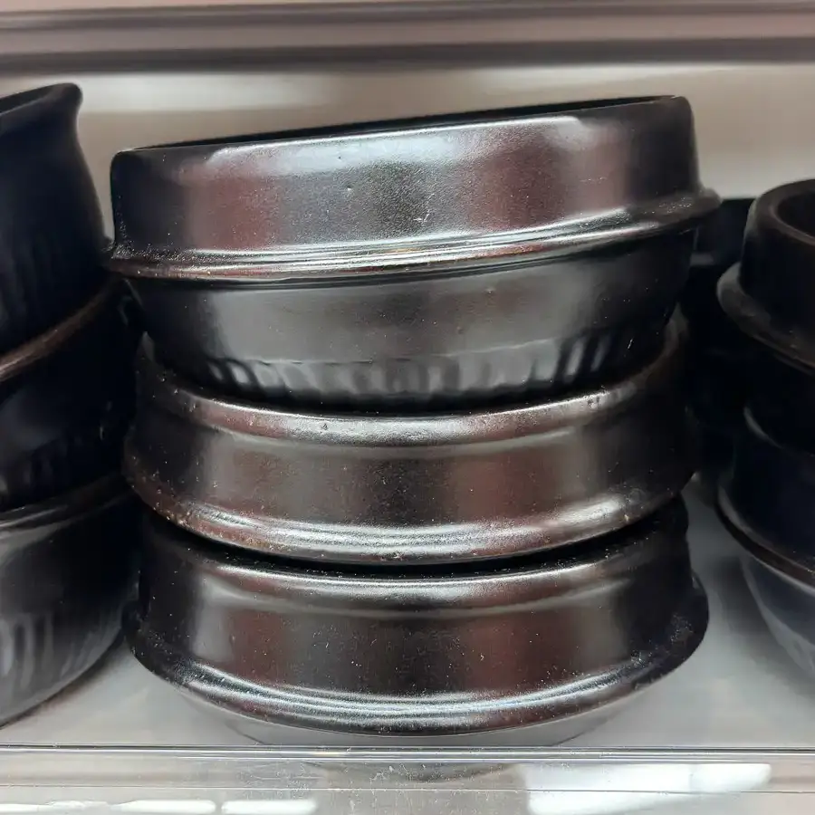 Top 10 Daiso Kitchen Items - Korean Restaurant Tableware Set Black ttukbaegi stone pot bubbling with stew, classic Daiso kitchen items