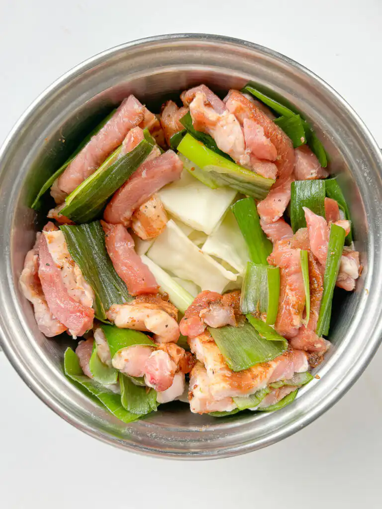 Spring Onion Bossam (Suyuk) – Juicy Waterless Pork Belly raw pork belly with green onion and cabbage