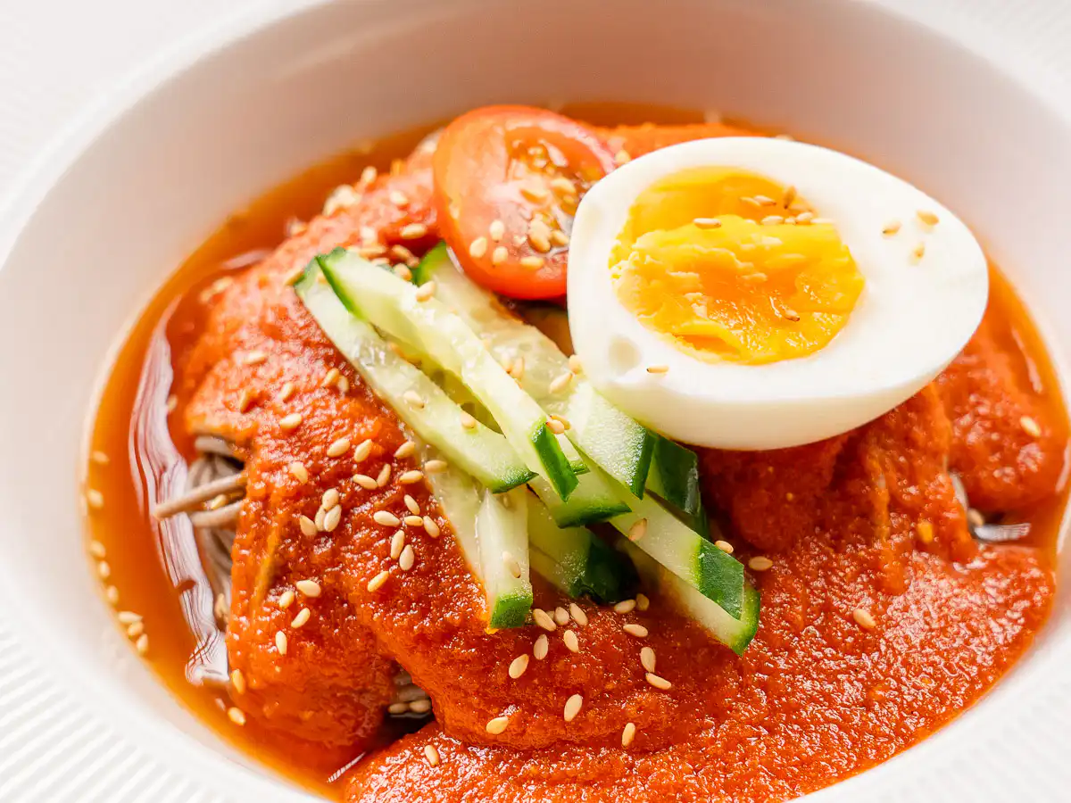 Tomato Gochujang Bibim Guksu - Summer Spicy Cold Noodles gochujang tomato noodles showing the creamy blended sauce texture