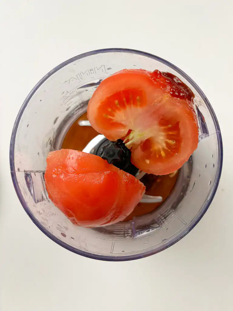 fresh tomato garlic gochujang and seasonings in a blender before blending