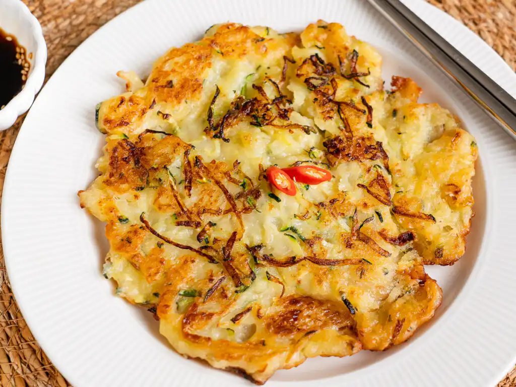 My mom's crispy golden brown zucchini pancake with onion