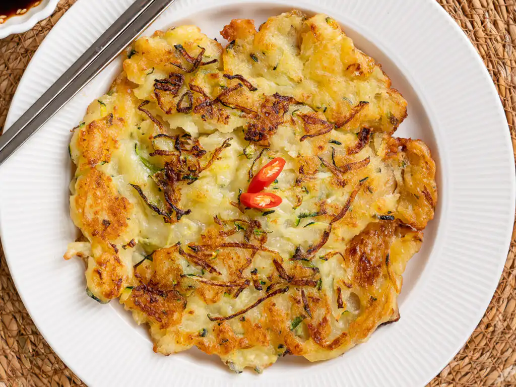 Close-up of zucchini korean pancake showing crispy edge