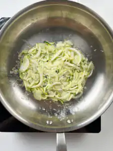 Batter spreading into an even layer in the pan
